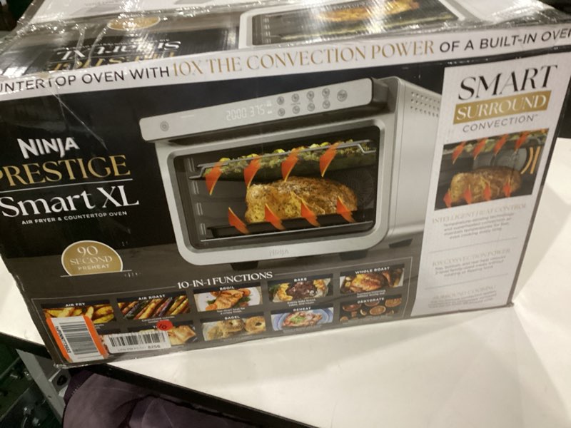 Condition photo showing As Is for Ninja Air Fryer & Toaster Oven | Prestige Smart XL Countertop Oven | Bakes up to 20 Cookies, Fits up to a 12lb Turkey | Pizza, Toast, Bake, Air Fry & Reheat | 1800 Watts | Stainless Steel | DT501? Stainless 10-in-1