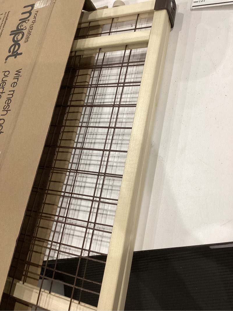 Condition photo showing Good Condition for mypet north states wire mesh dog gate: 26.5-42" wide. pressure mount. no tools needed. dog gate 23" tall, expandable, durable dog gates for doorways, sustainable hardwood