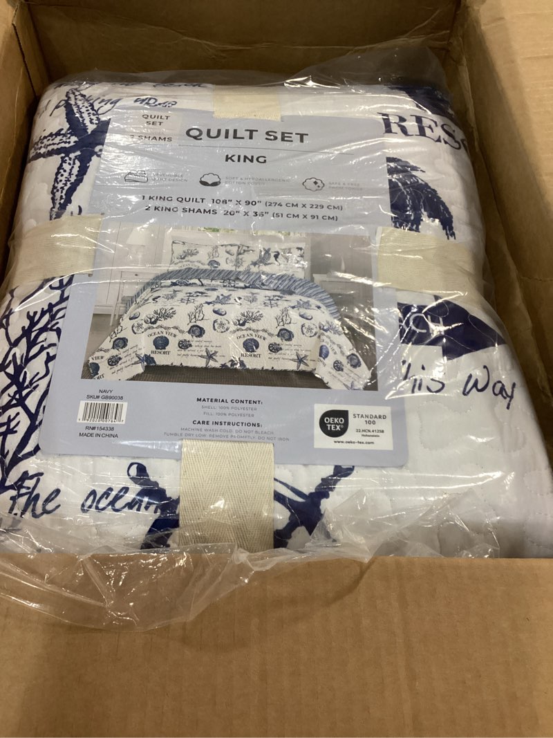 Condition photo showing Good Condition for navy coastal quilt bedding set, summer coastal quilt with shams, beach 3-piece reversible all season bedspread quilt set. lightweight nautical quilted coverlet. catalina collection, navy. king / california king navy