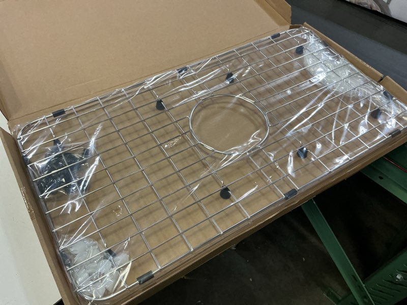 Condition photo showing Good Condition for serene valley sink bottom grid 24-1/8" x 12-5/8", centered drain with corner radius 1-1/2", sink protector nlw2412c