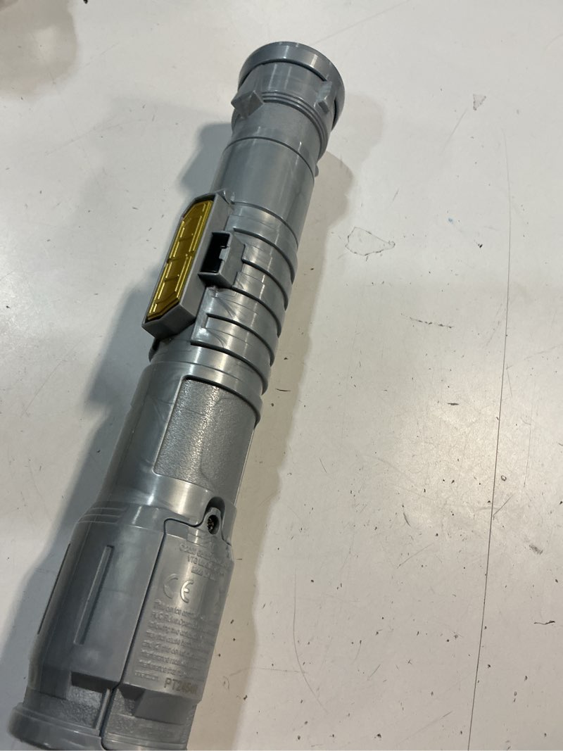 Condition photo showing As Is for power saber energy blade red | first ever automatic saber | auto extending & retracting saber | extends 35" (90cm) | motion based sfx | ages 6+ | by goliath