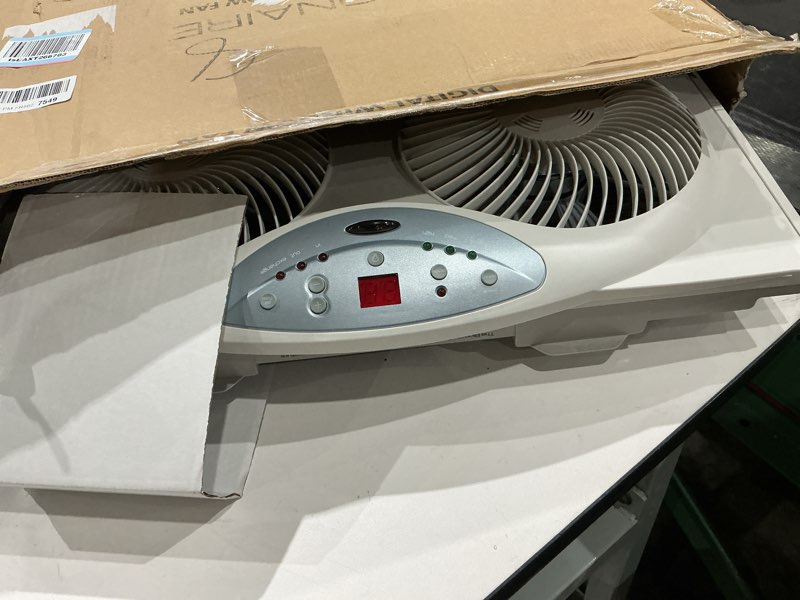 Condition photo showing Good Condition for bionaire window fan with reversible airflow blades – 3-speed settings, programmable thermostat, led display, remote control, fits 24–36" windows, no assembly required white 2 blades electronic control with lcd screen window fan