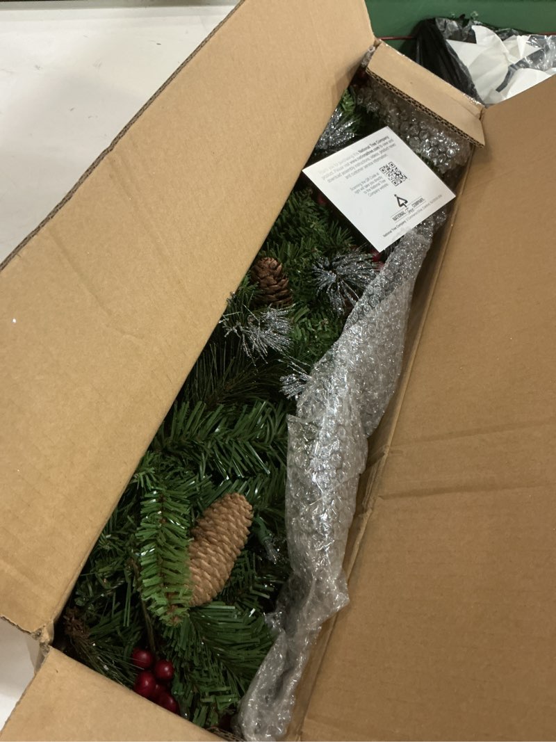 Condition photo showing Good Condition for national tree company 9 ft pre-lit crestwood spruce artificial christmas garland, christmas decoration with glitter, pinecones, red berries, 50 clear lights, 180 tips, green