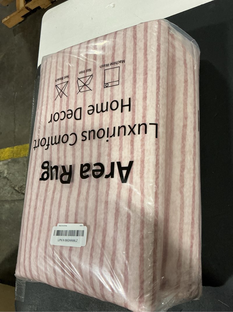 Condition photo showing New/Like New for Wonnitar Washable Striped Living Room Area Rug 5x7, Non-Slip Berber Stripe Pink Area Rugs for Bedroom Girls, Low Pile Soft Large Throw Carpet for Kids Nursery Room (Pink,5' x 7') 5' x 7' (Rectangular) Pink