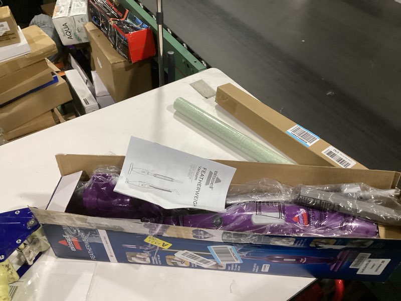 Condition photo showing New/Like New for Bissell Featherweight Stick Lightweight Bagless Vacuum with Crevice Tool, 20334, Purple