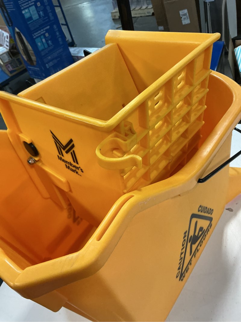 Condition photo showing As Is for mind reader mop bucket with wringer (mop not included), 5.5 gallon cleaning bucket with wheels and handle, upward press wringer, small mop compatible, yellow mop bucket only yellow