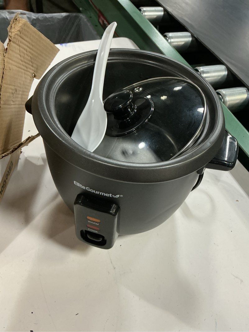 Condition photo showing As Is for elite gourmet erc006xss 6-cup electric rice cooker with 304 surgical grade stainless steel inner pot, makes soups, stews, porridges, grains and cereals, 6 cup (3 cups uncooked), black