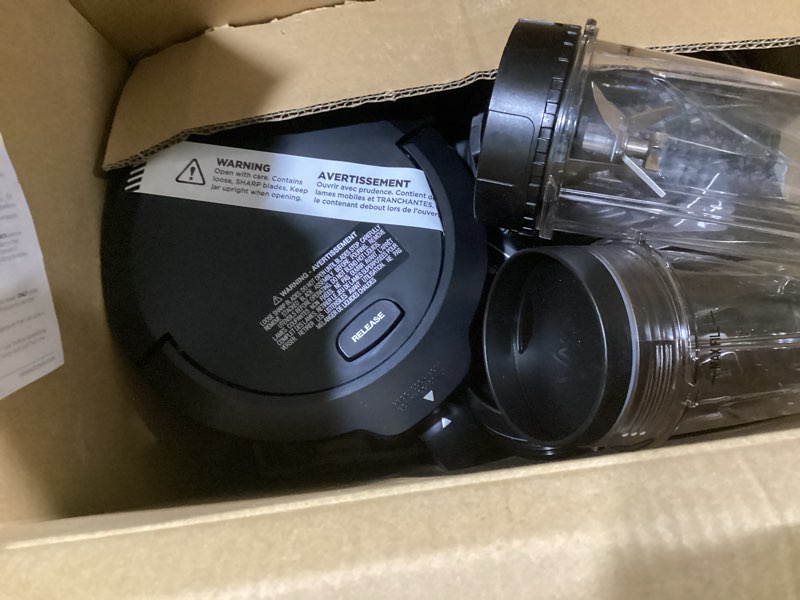 Condition photo showing As Is for (incomplete) ninja mega kitchen system (blender, processor, nutri ninja cups) bl770