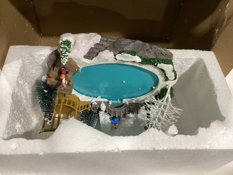 Condition photo showing Good Condition for Christmas Village House Christmas Collectible Buildings Decor Estatua de la cabaña del Pueblo navideño Home Decoration Snow Globe Display Skating Pond AnimatedChristmas Theme Park with 8 Music X-Large Skating XL