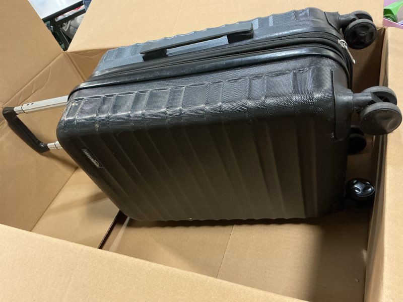 Condition photo showing As Is for amazon basics 21" hardside carry-on luggage, hardshell suitcase with wheels, expandable for up to 25% more space, with scratch-resistant surface, four multi-directional wheels, black black carry-on