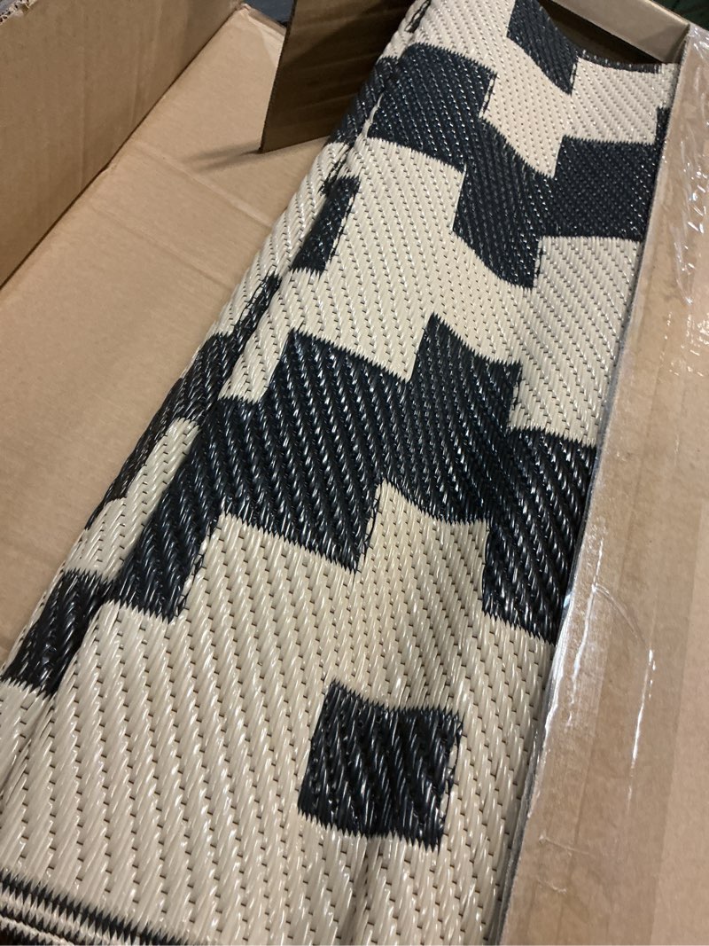Condition photo showing As Is for sand mine waterproof outdoor rug 5x8 ft, plastic reversible rug, modern area rug, large floor mat for outdoors, rv, patio, backyard, deck, picnic, beach, camping, black & beige