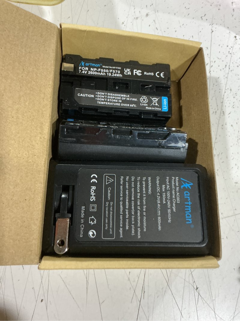 Condition photo showing As Is for artman np-f550 battery 2-pack and wall charger for sony np f550, f530, f970, f960, f770, f750, f330, ccd-sc55, tr516, tr716, tr818, tr910, tr917 camera, cn-160, cn-216 led video light (2600 mah)