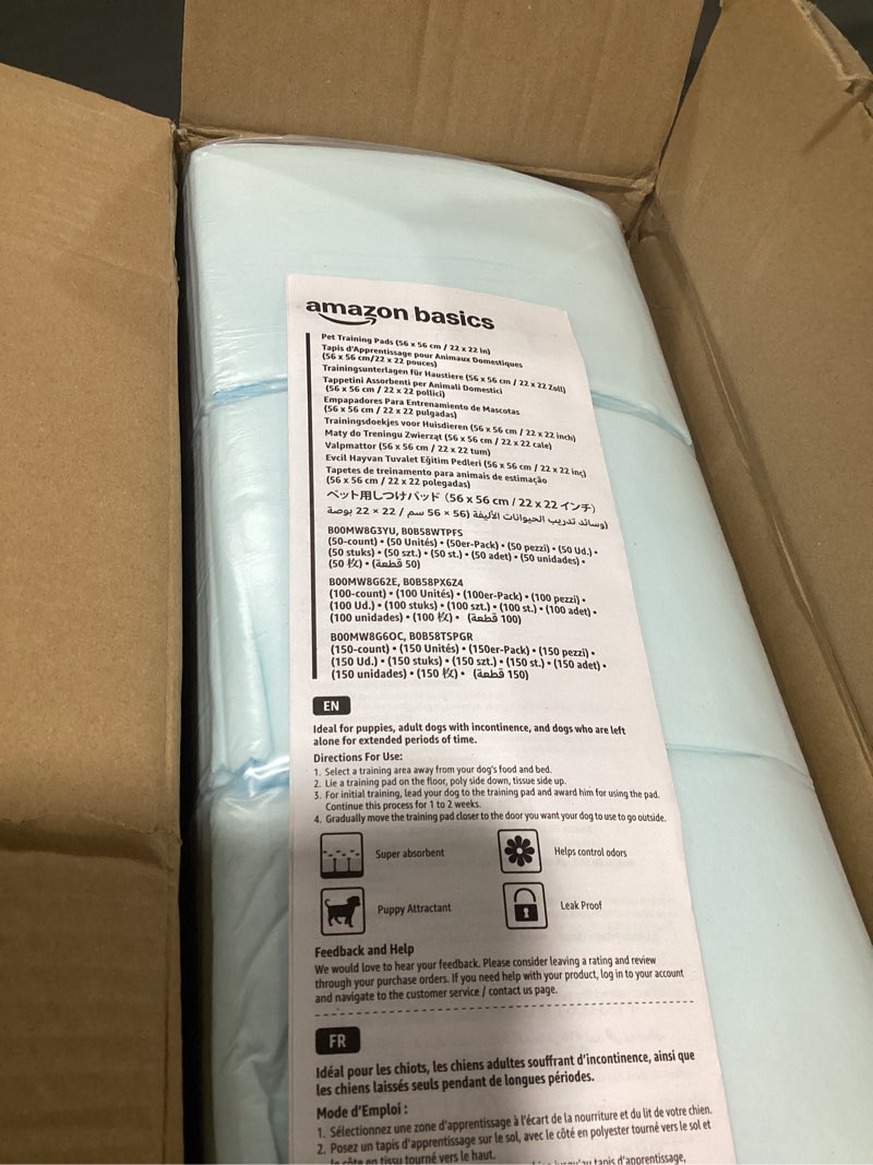 Condition photo showing As Is for Amazon Basics Dog and Puppy Pee Pads, 5-Layer Leak-Proof Super Absorbent, Quick-Dry Surface, Potty Training, Regular (22x22"), 150 Count, Blue & White
