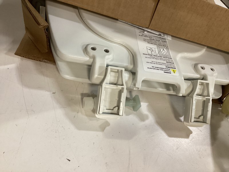 Condition photo showing As Is for mayfair nextstep2 toilet seat with built-in potty training seat, slow-close, removable that will never loosen, elongated, white elongated 1
