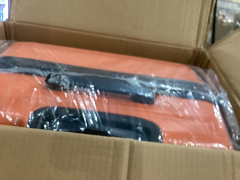 Condition photo showing Good Condition for amazon basics 30" hardside large checked luggage, expandable for up to 15% more space, hardshell suitcase with wheels, scratch-resistant surface, four multi-directional wheels, orange orange large checked