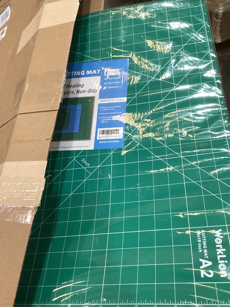Condition photo showing Good Condition for worklion 18'' x 24'' large self healing pvc cutting mat, double sided, gridded rotary cutting board for craft, fabric, quilting, sewing, scrapbooking - art project… 24"l x 18"w green/blue