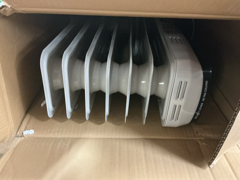 Condition photo showing As Is for Amazon Basics Portable Oil Radiator Heater for Indoor Use, 3 Heat Settings, Over-Heat Protection, ETL-certified Safety, 7 Oil-Filled Steel Fins, 1500W, 11"D x 14.8"W x 25.2"H, White