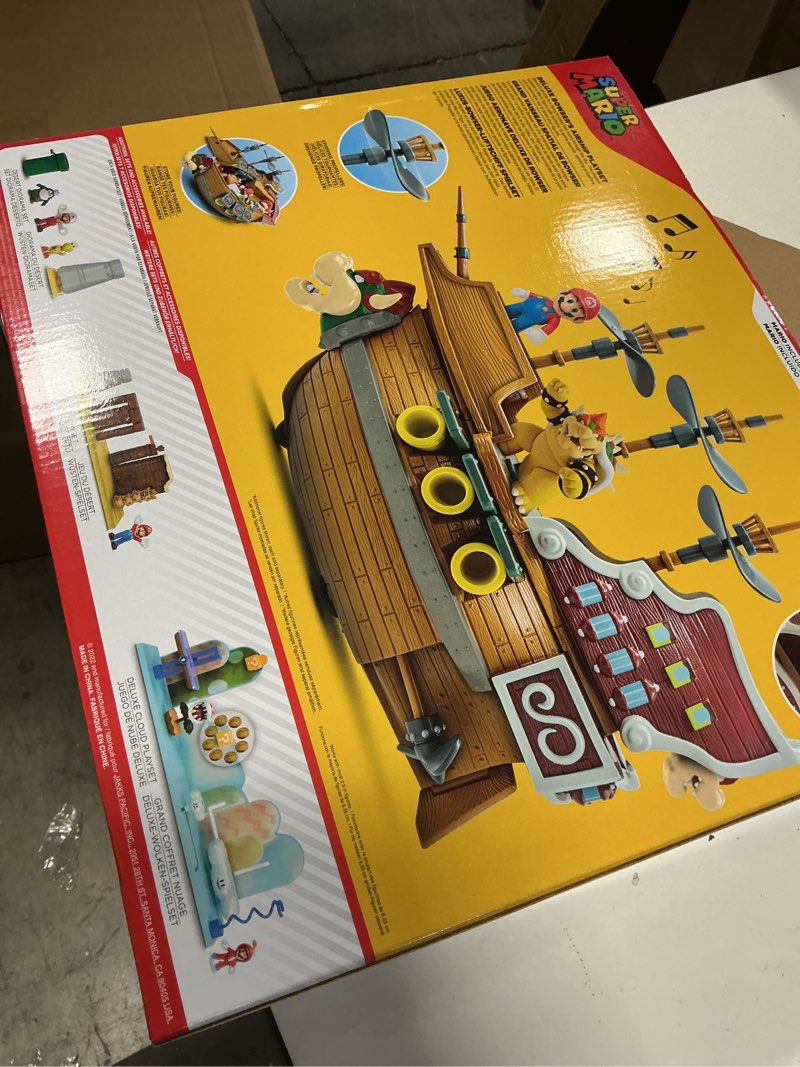 Condition photo showing New/Like New for Super Mario Deluxe Bowser's Air Ship Playset with Mario Action Figure – Authentic in-Game Sounds & Spinning Propellers