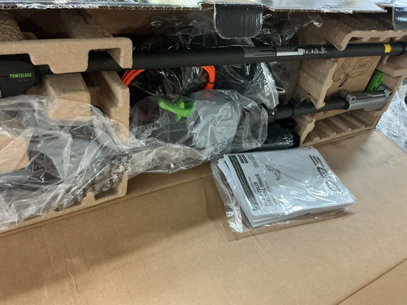 Condition photo showing As Is for ego power+ multi-head system with line iq, powerload 56-volt 17-in straight shaft attachment capable battery string trimmer 5 ah (battery included) (charger included)
