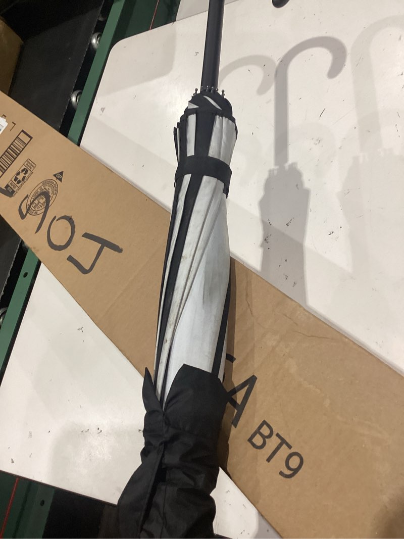 Condition photo showing Good Condition for full size dark wing pagoda umbrella - ideal for all weather, perfect for vampires, gothic enthusiasts, and lovers of unique bat wing style black and white