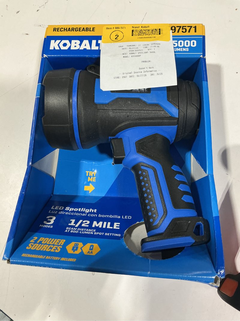 Condition photo showing As Is for dual power led spotlight flashlight kit, 5000 lumens, 3 beam modes, runs on rechargeable lith-ion battery or aa batteries, water resistant handheld light, 1/2 mile beam, compatible with kobalt systems  its says it does  work