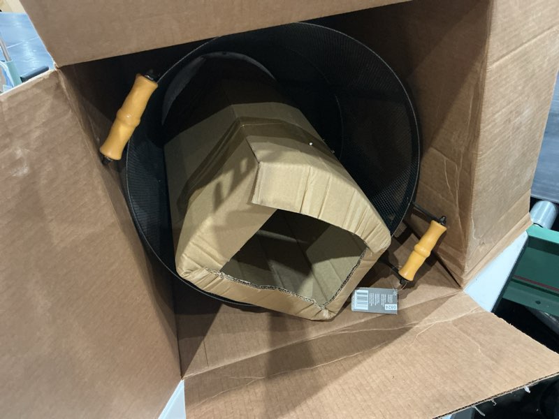 Condition photo showing Good Condition for the pleasant hearth log bin holds and stores firewood. the convenient handles make it easy to transport wood to your fireplace. the stylish vintage iron finish makes it a perfect accessory to display on the hearth. fully assembled.