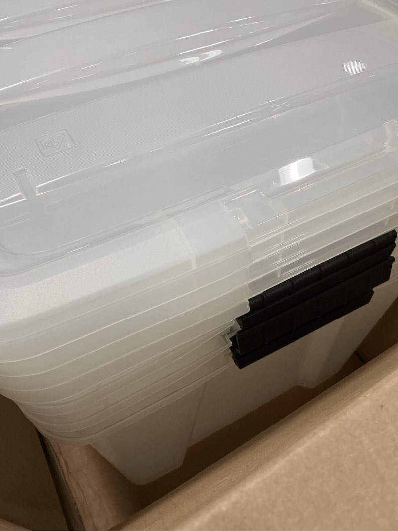 Condition photo showing Good Condition for IRIS USA 72 Qt Stackable Plastic Storage Bins with Lids, 4 Pack - BPA-Free, Made in USA - See-Through Organizing Solution, Latches, Durable Nestable Containers, Secure Pull Handle - Clear Clear 72 Qt 4 Pack