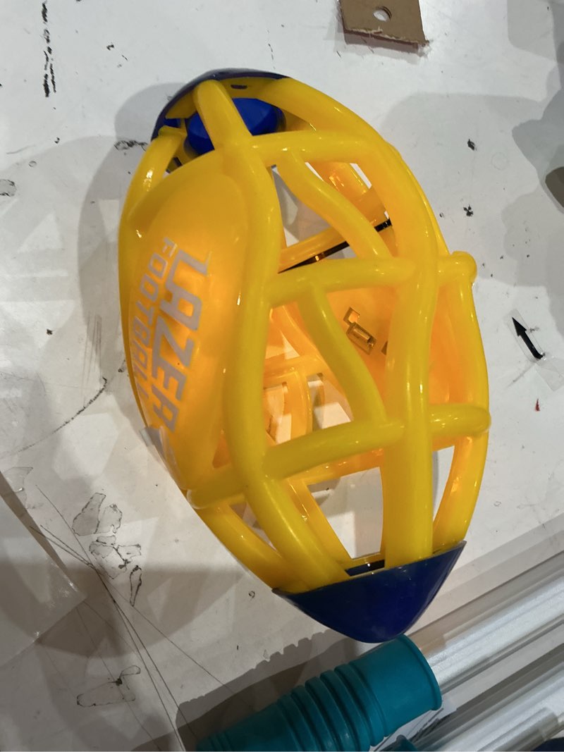 Condition photo showing As Is for lazer light up glow rubber toy football, yellow, pee wee size 3