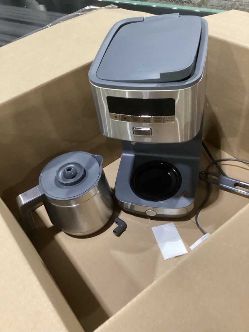 Condition photo showing As Is for ge drip coffee maker with timer | 10-cup thermal carafe coffee pot keeps coffee warm for 2 hours | adjustable brew strength | wide shower head for maximum flavor | kitchen essentials | stainless steel, not tested