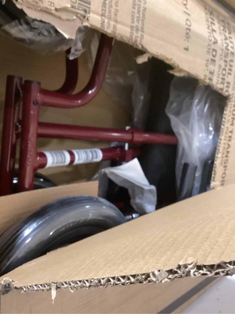 Condition photo showing As Is for Medline Lightweight Foldable Transport Wheelchair with Handbrakes and 12-Inch Wheels  Red Frame  Black Upholstery