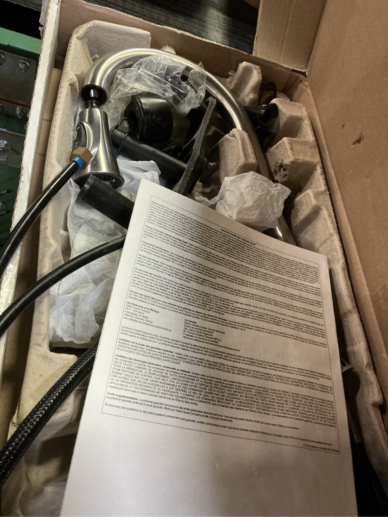 Condition photo showing As Is for Delta Ophelia Brushed Nickel Kitchen Faucet with Pull Down Sprayer, Modern Single Hole Kitchen Sink Faucet, Single Handle, SpotShield Stainless 19888Z-SP-DST SpotShield Stainless Standard Activation