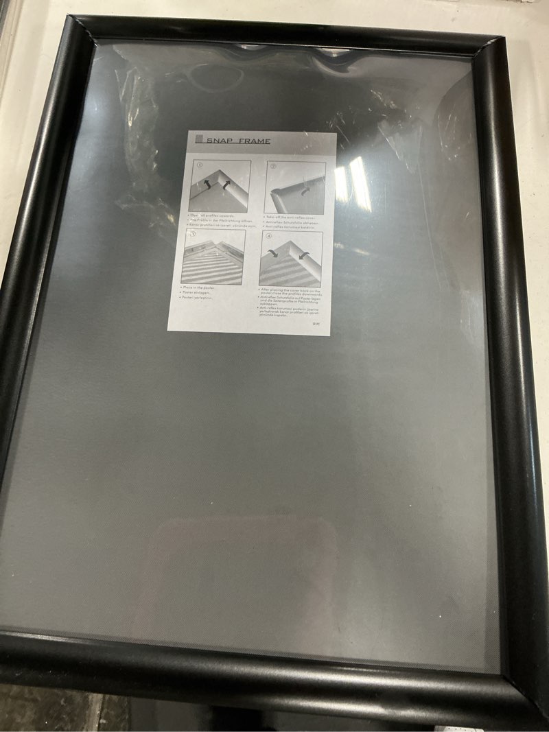 Condition photo showing As Is for 13”x18” black snap frame  mitred corners poster holder anti-glare cover  display(2 pcs)