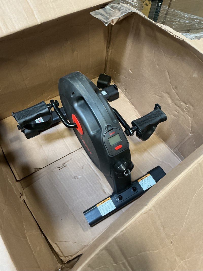 Condition photo showing New/Like New for Sunny Health & Fitness Smart Under-Desk Bike Exerciser, Low-Impact Cardio Cycling Equipment for Home/Office, Mini Paddler for Arm/Leg Mobility Training, Free SunnyFit App Connect, Optional Motorized Black