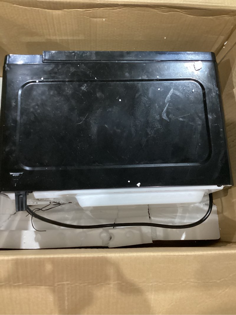 Condition photo showing As Is for chefman countertop microwave oven 1.1 cu. ft., 1000 watts with 10 power levels, 6 cooking presets with one-touch express cook, eco mode, child safety lock, & mute button - black