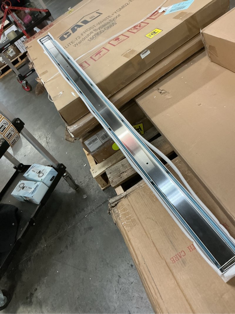 Condition photo showing Good Condition for neodrain 60-inch linear shower drain with tile insert grate,brushed 304 stainless steel rectangle shower floor drain, linear drain with leveling feet, hair strainer brushed 60 in