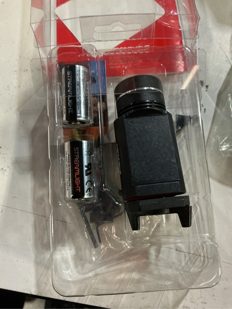 Condition photo showing New/Like New for streamlight 69260 tlr-1 hl 1000-lumen 20000 candela rail-mounted tactical weapon light with specific compatibility rail locating keys, black non-rechargeable black