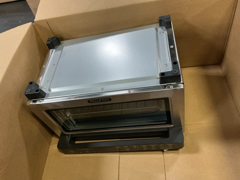 Condition photo showing As Is for gourmia toaster oven digital air fryer - convection mode with 4 slice capacity, 3 rack positions, 12 presets, toast, bagel, bake, roast, broil, dehydrate, popcorn, fits 9" pizza, stainless steel large silver