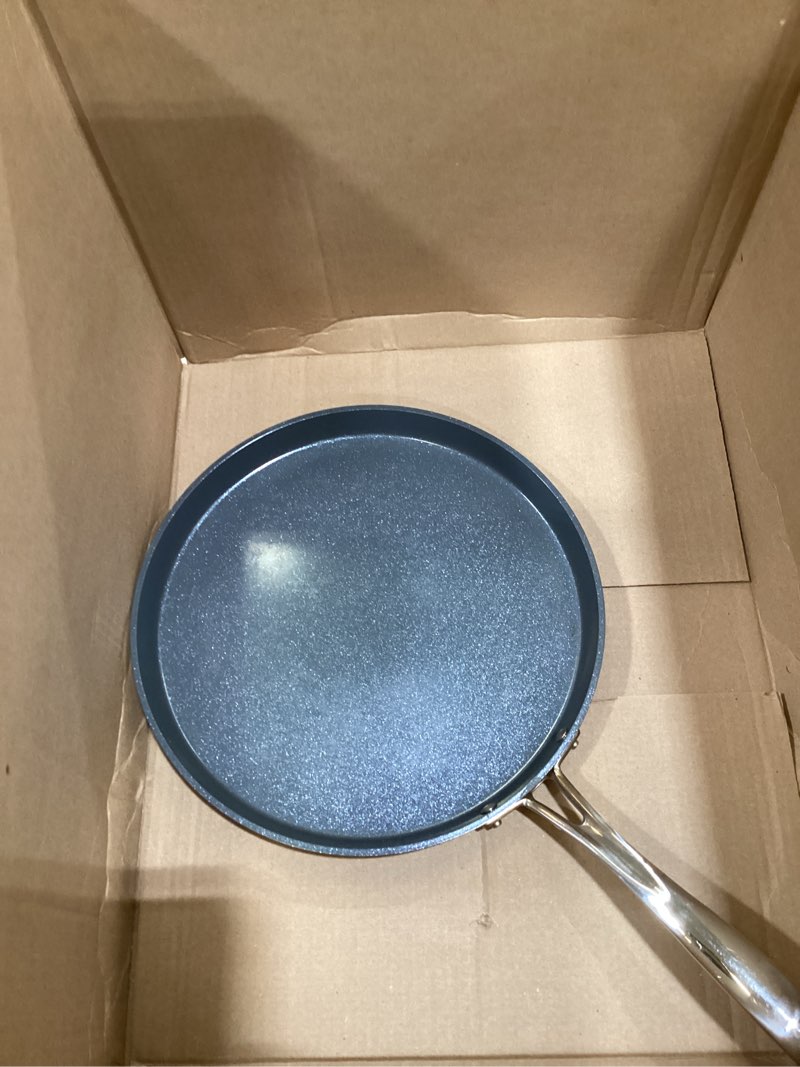 Condition photo showing Good Condition for Tramontina Utsava 12-Inch Tri-Ply Clad Stainless Steel Ceramic-Coated Dosa Tawa, Non Stick Tava Pan for Roti, Crepe Pan, Comales para Tortillas, Pancake Griddle, Nonstick Flat Skillet 12-Inch (Flat) Stainless Steel