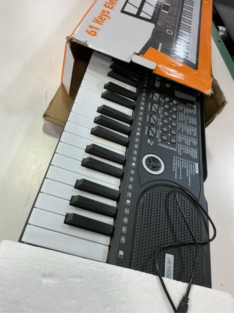 Condition photo showing Good Condition for 61 keys keyboard piano, electronic digital piano with built-in speaker microphone, sheet stand and power supply, portable piano keyboard gift teaching for beginners black