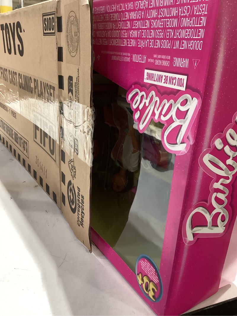 Condition photo showing New/Like New for barbie fast cast clinic playset, brunette barbie doctor doll, 30+ play pieces, 4 play areas, cast & bandage making, medical & x-ray stations, exam table, gift shop & more, great toy for 3 years & up