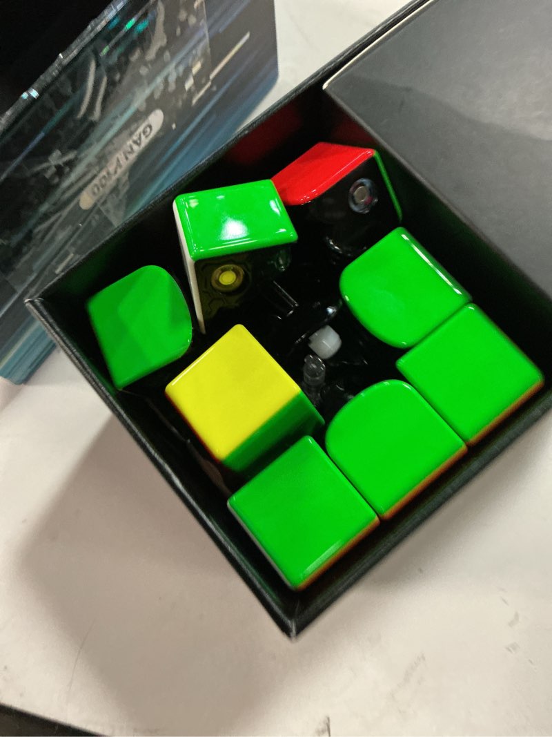 Condition photo showing As Is for gan v100 maglev uv speed cube 3x3 magnetic, omni-directional positioning 64g lightweight speedcube brain teaser puzzle fidget toy for kids adults, 55mm black inner surface uv version