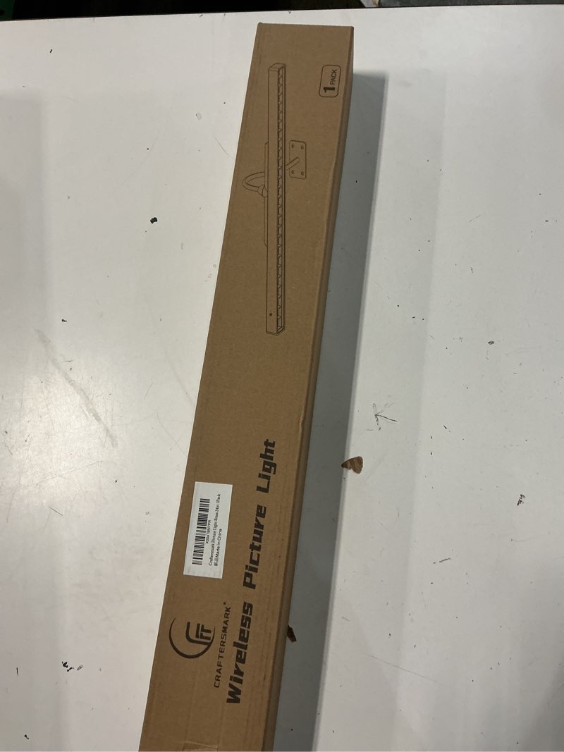 Condition photo showing New/Like New for 24 inch picture light for wall - battery operated wireless wall sconce with remote & timer for artwork, portrait, photo & frame (antque gold) antique gold 24in-1pack