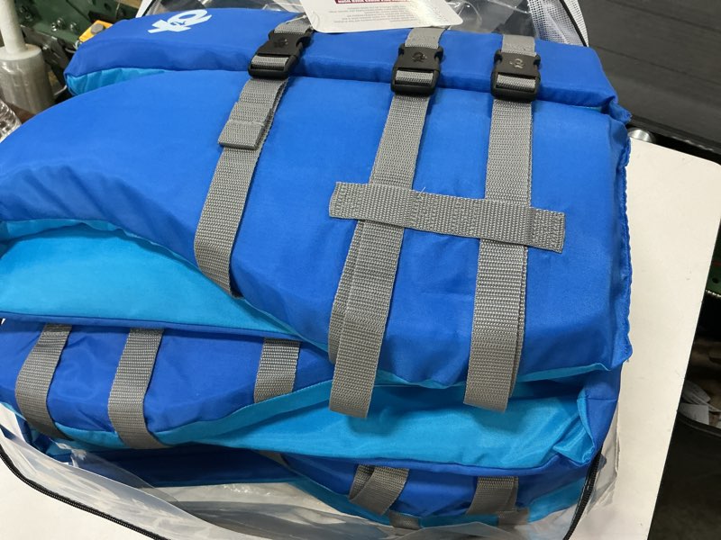 Condition photo showing As Is for (missing boat cushion) x2o adult universal life vest & jacket plus boat cushion - blue ocean coral
