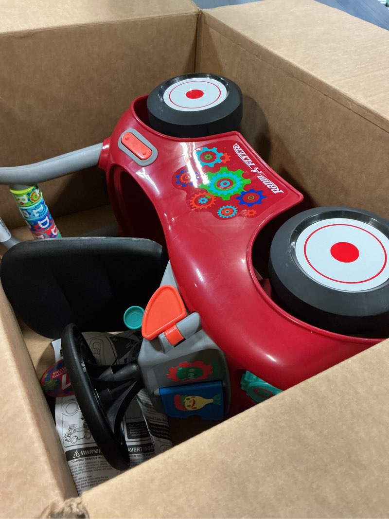 Condition photo showing As Is for Radio Flyer Busy Buggy, for Toddlers 1-3, 3-in-1 Push Walker Ride On Car with 17 Sensory Activities, Anti-Tip Feature, Under-Seat Storage, Horn and Gears, 42 lb Capacity, Toddler Ride On Toys Red