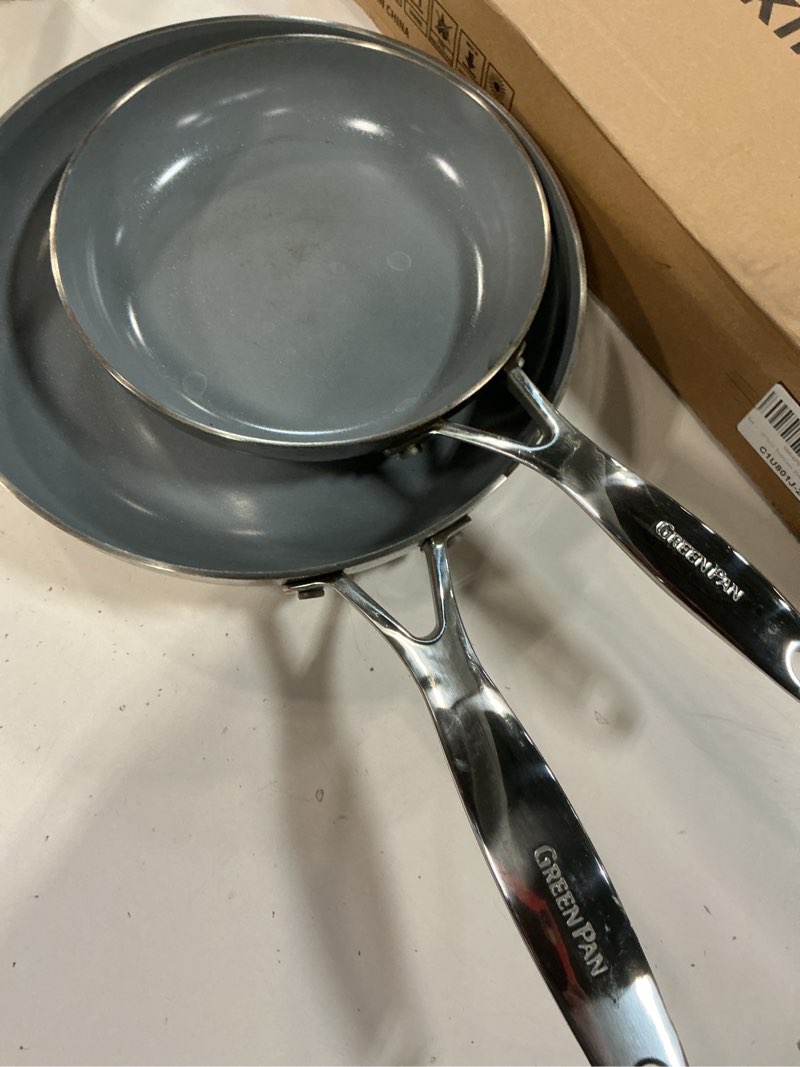 Condition photo showing As Is for Amazon Basics 2-Piece Non-Stick Stainless Steel Fry Pan Set, Oven and Induction Safe, 10-Inch and 8-Inch