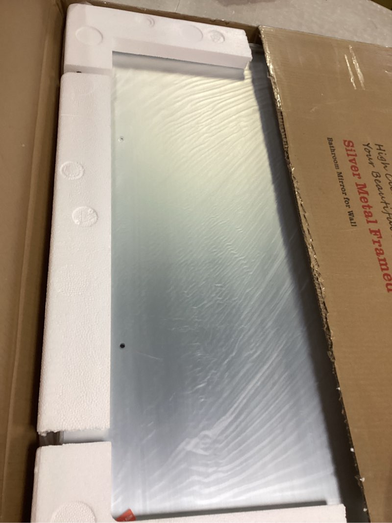 Condition photo showing Good Condition for LOAAO 24X30 Inch Brushed Nickel Bathroom Mirror, Rounded Rectangle Silver Metal Frame Mirror, Brushed Nickel, Anti-Rust, Shatter Proof, Hangs Horizontally or Vertically Brushed Nickel 24"L x 30"W