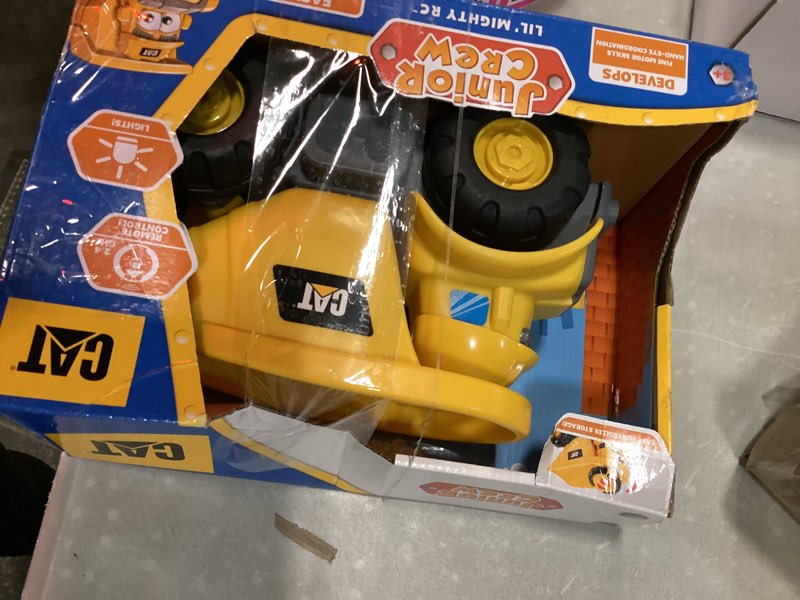 Condition photo showing Good Condition for cat construction toys, junior crew lil' movers remote control truck, rc car + dump truck, working headlights, with child friendly controller