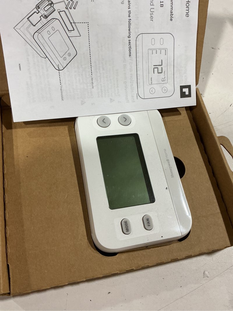 Condition photo showing As Is for honeywell home x1n heating and cooling push button non-programmable thermostat