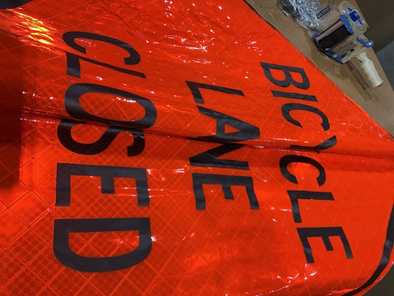 Condition photo showing New/Like New for roll-up sign-36" superbright-bicycle lane closed