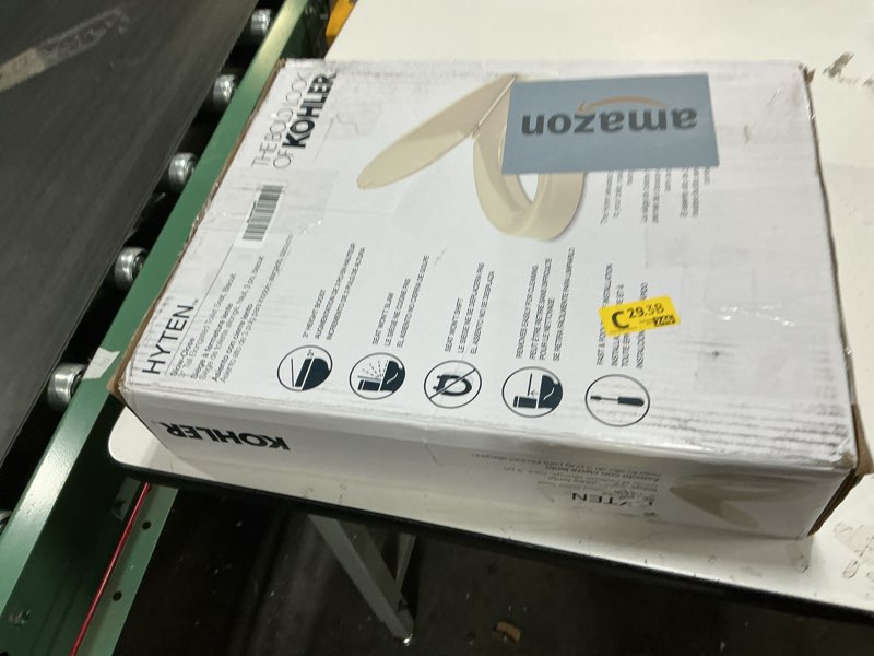 Condition photo showing As Is for KOHLER 25875-96 Hyten 3" Height, Elevated Soft Close Elongated Toilet Seat, Contoured Seat with Grip-Tight Bumpers, Quick-Attach Hardware, No Slam Toilet Seat, Biscuit Biscuit Elongated